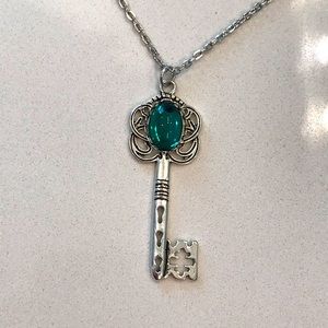 Silver necklace with key pendant. Chain is 20”, Pendant is 2.25” x 1”